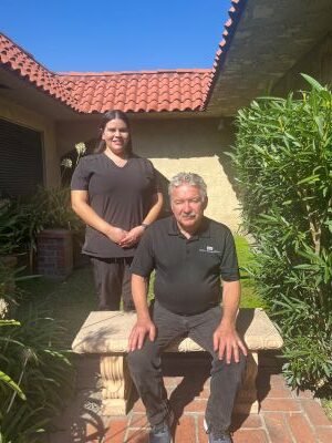 Portrait of Dr David Newsham Dental implant specialist with his Dental Assistant